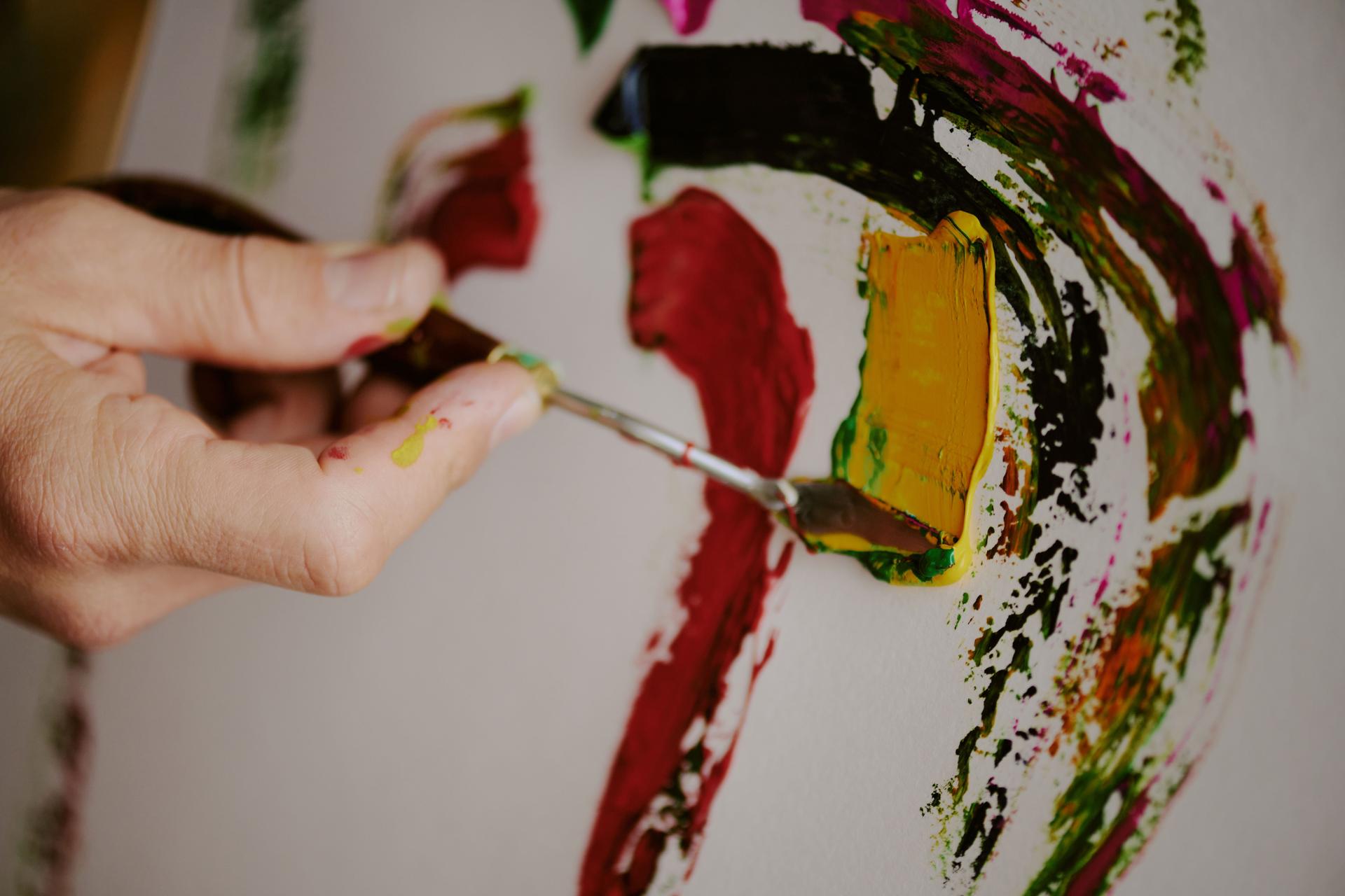 Hand Of Unrecognizable Artist Painting